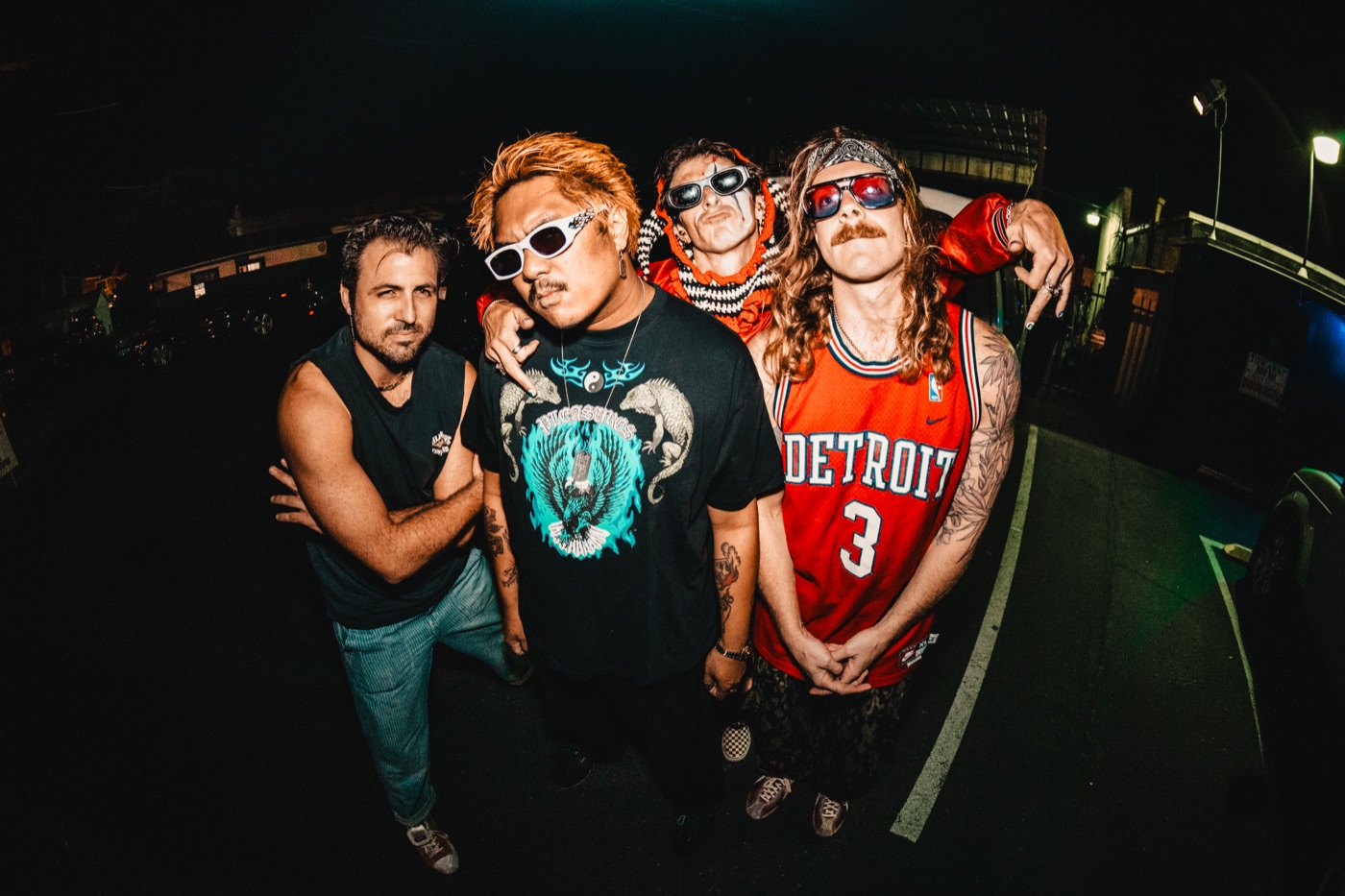 Catching Klover — the four band members photographed at night outside Soda Bar in San Diego.